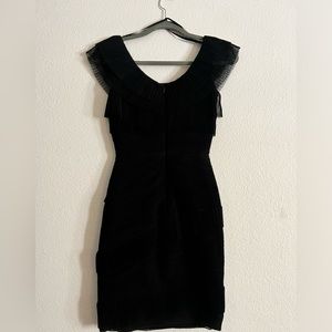 Only worn once, stretch, slim fit with ruffles, very elegant, over the knee.